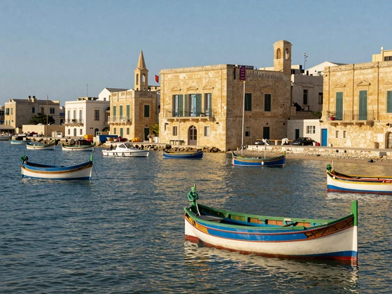 Traditional Maltese fishing village Marsaxlokk with colorful luzzu boats in harbor and honey-colored limestone buildings